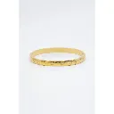 Bracelet jonc céleste gravé doré sur fond blanc.webp